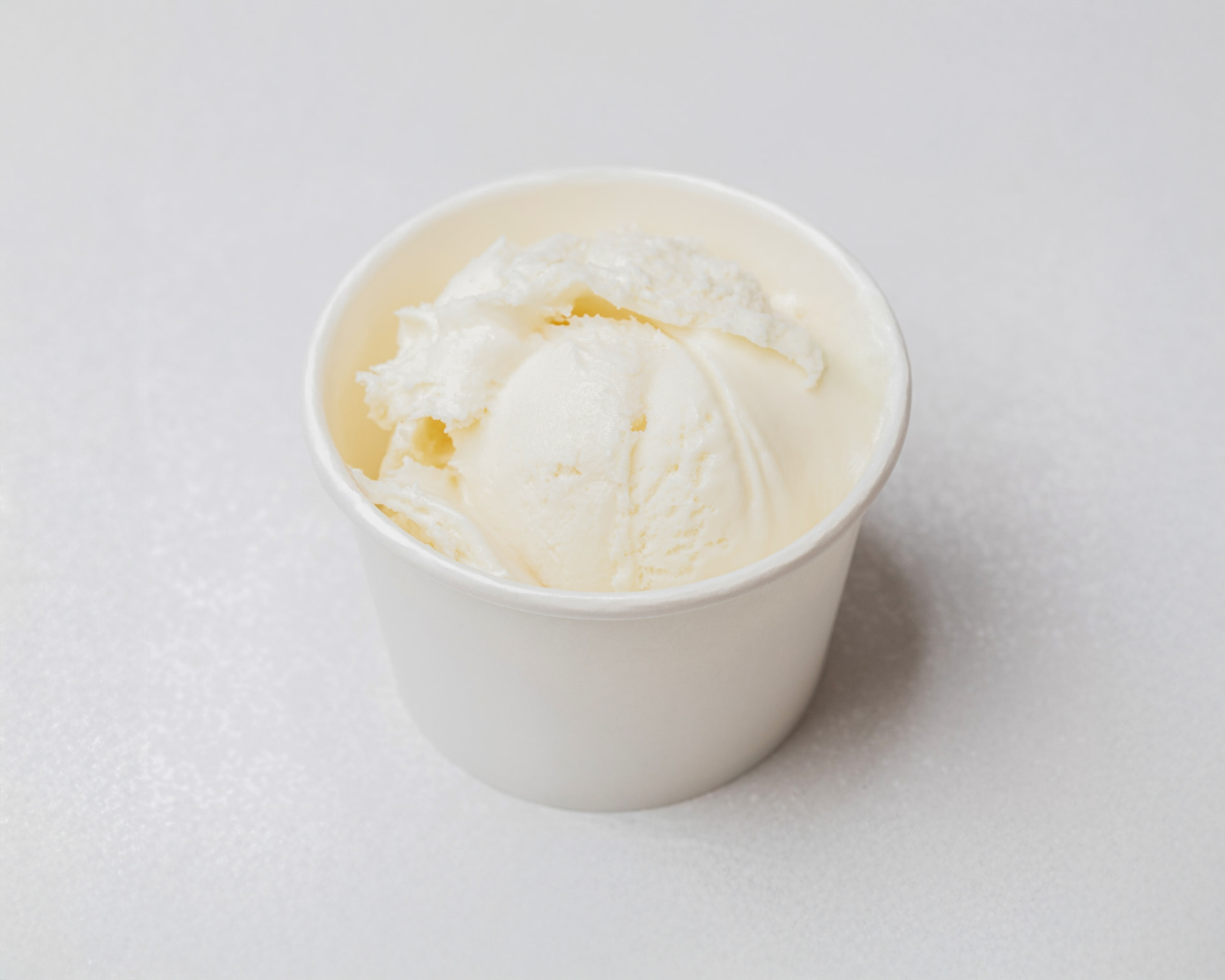 Vanilla ice cream in a white cup
