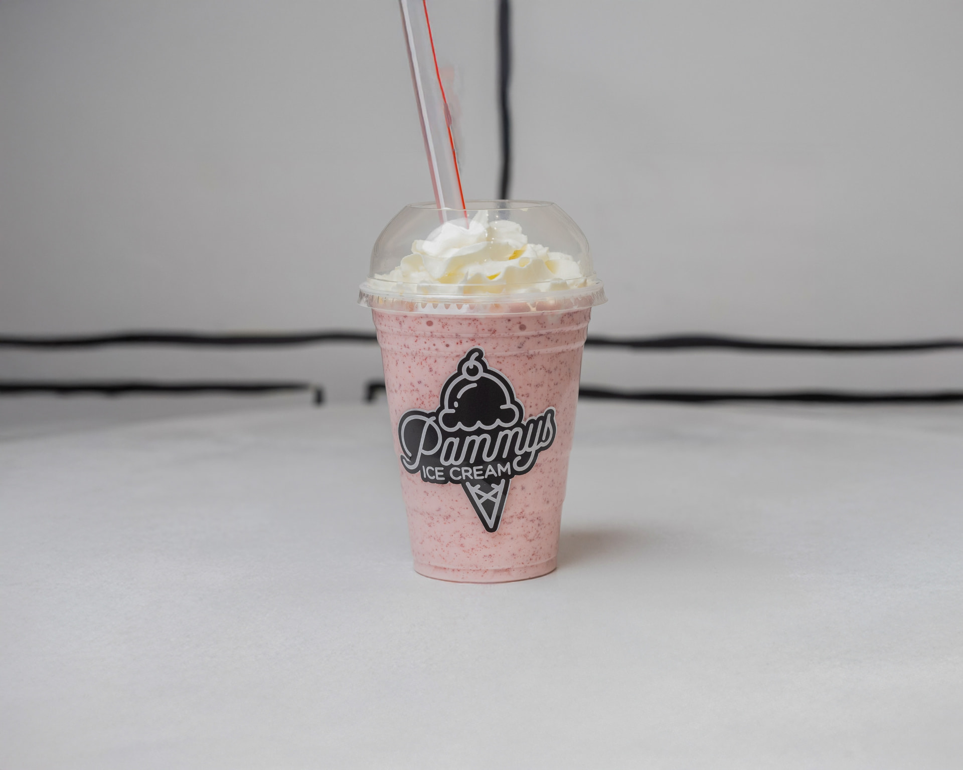 Pink Pammy's milkshake topped with whipped cream