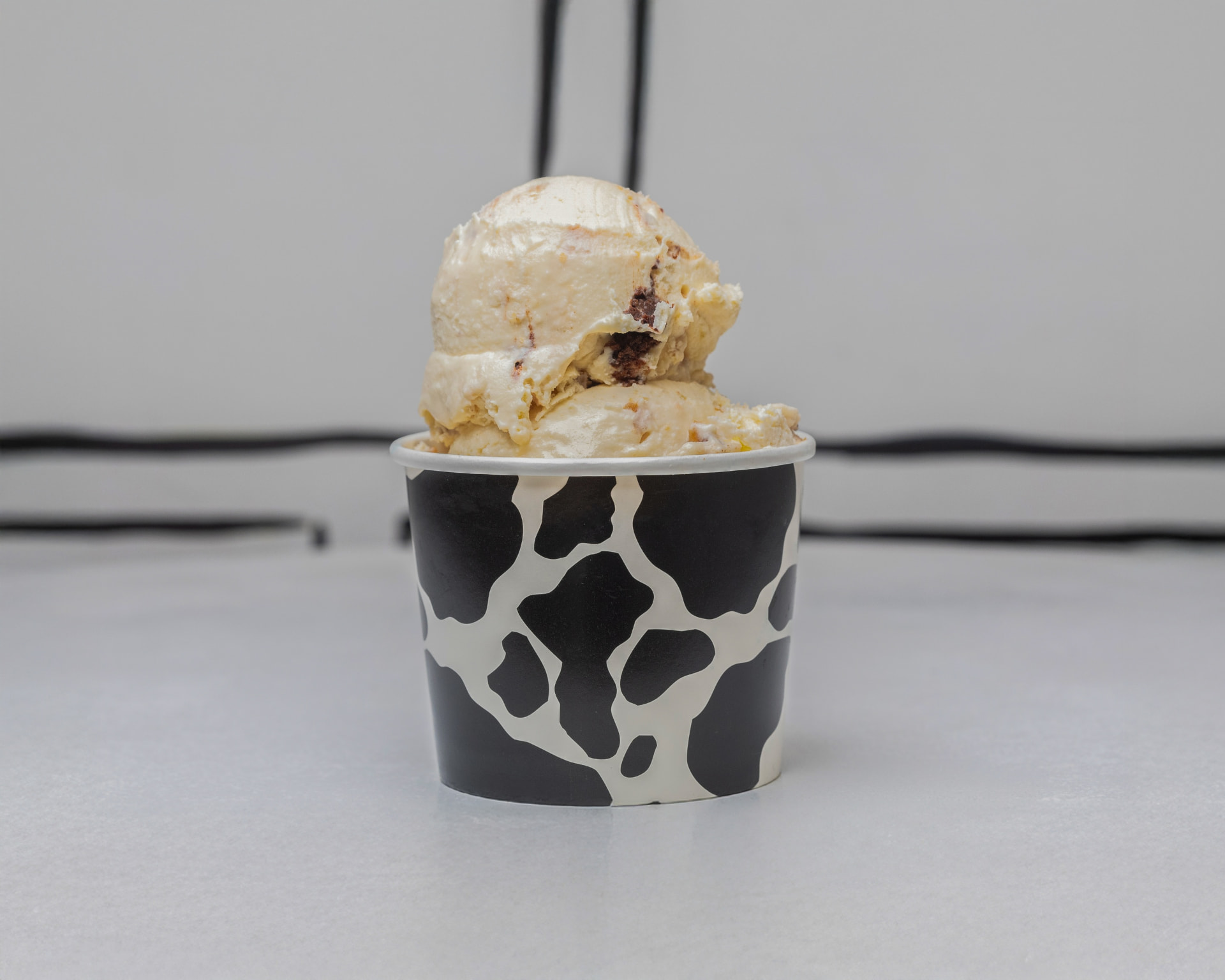 Double scoop of peanut butter brownie ice cream in a cup